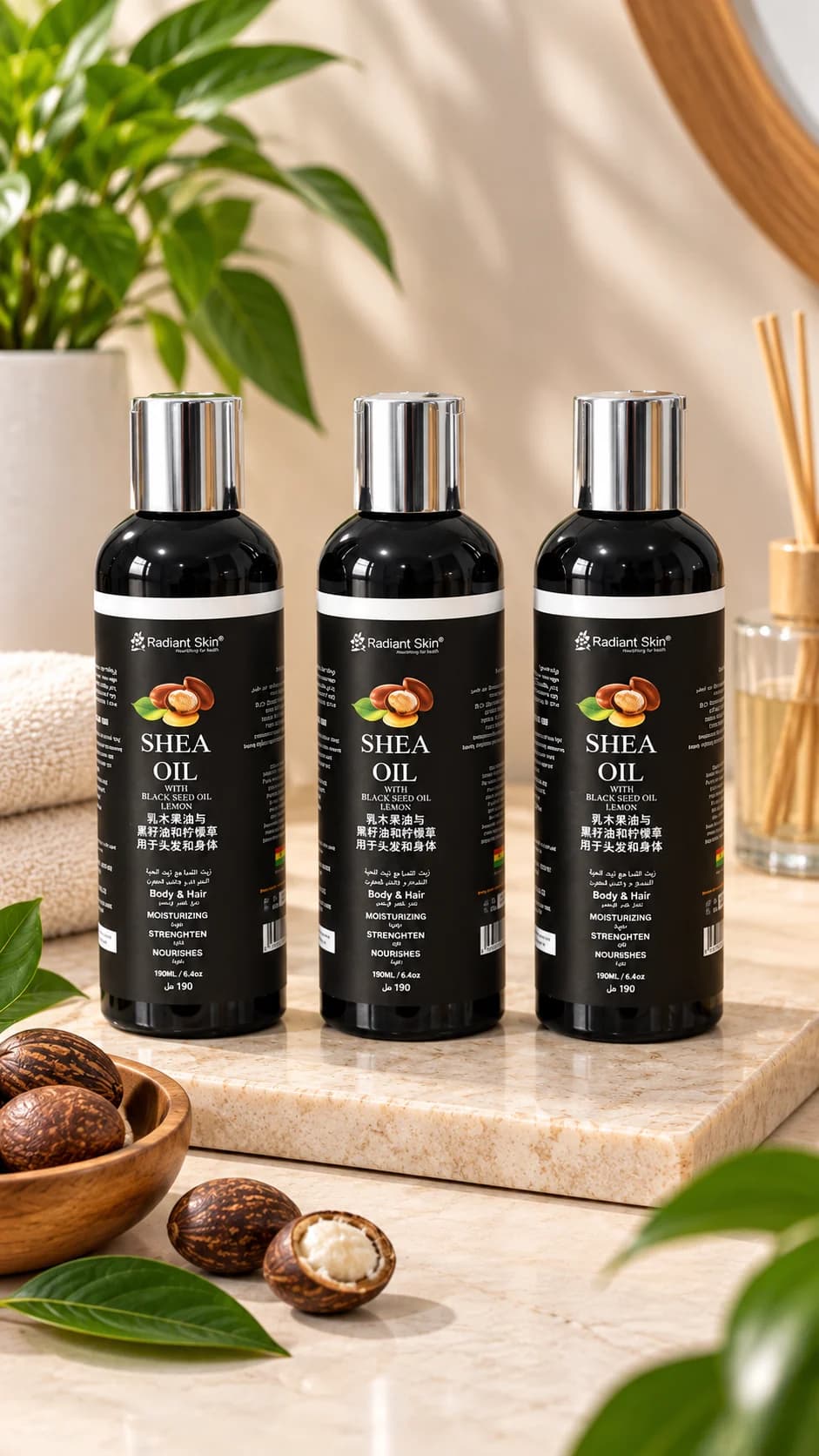 Three bottles of Debbitone Brightening Shea Oil beside whole shea nuts