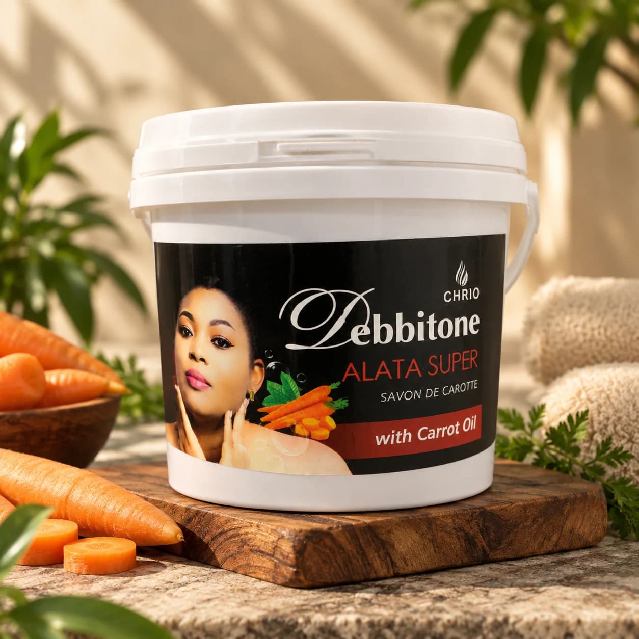 A 1kg bucket of Debbitone Carrot Lightening Alata Super Soap beside fresh carrots